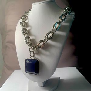 Chunky silver necklace with large blue stone
